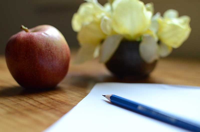 Photo of a still life and paper.